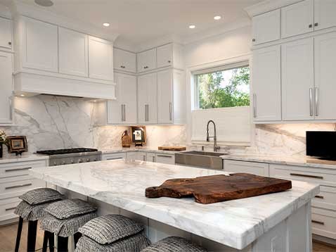 Kitchen with stone counters and backsplash